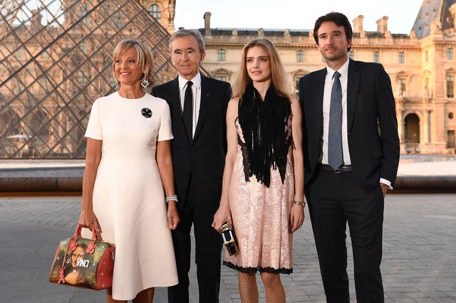 Bernard Arnault poses with his wife, Helene Mercier-Arnault, their son Antoine Arnault and his wife Russian model Natalia Vodianova outside the Louvre
