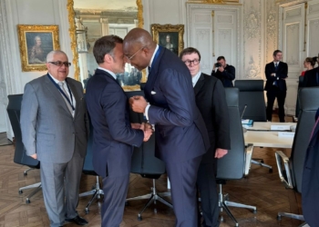 Aigboje Aig-Imoukhuede having a handshake and a tête-à-tête with President Macron at the Council’s meeting with the President, and Gilbert Chagoury looking on.