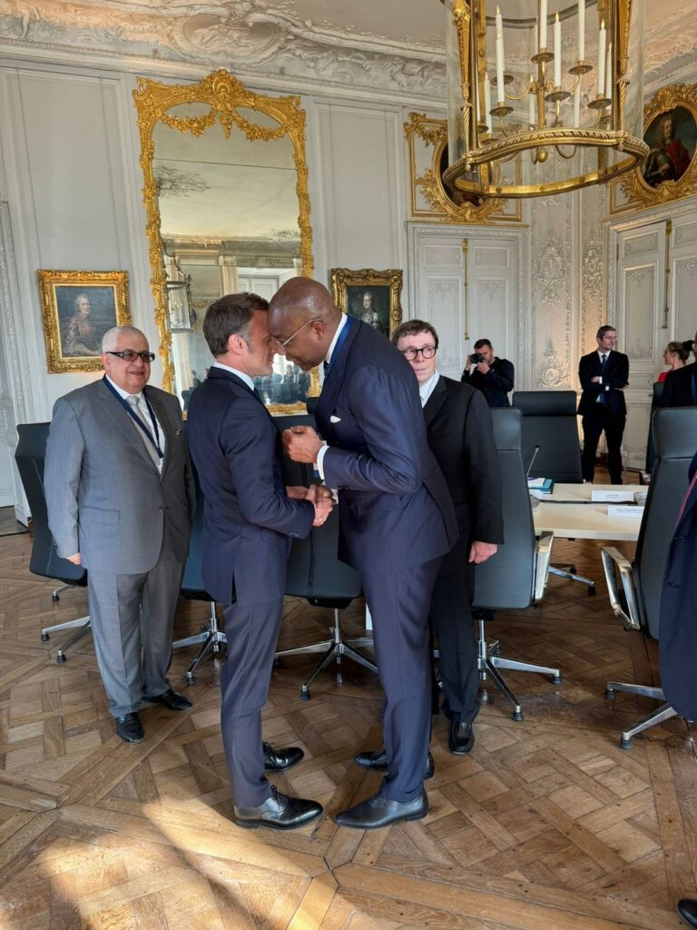 Aigboje Aig-Imoukhuede having a handshake and a tête-à-tête with President Macron at the Council’s meeting with the President, and Gilbert Chagoury looking on.