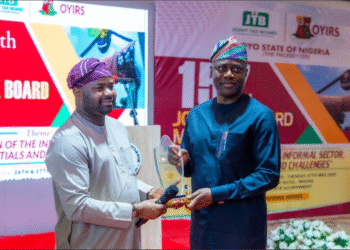 THE CHAIRMAN, FEDERAL INLAND REVENUE SERVICE, ZACCH ADEDEJI, SOUNDING A TALKING DRUM PRESENTED TO HIM BY GOVERNOR SEYI MAKINDE OF OYO STATE AT THE OPENING OF THE 157TH BOARD MEETING ON THE JOINT TAX BOARD (JTB) HELD AT THE JAG HOTEL IBADAN, OYO STATE, ON MONDAY.